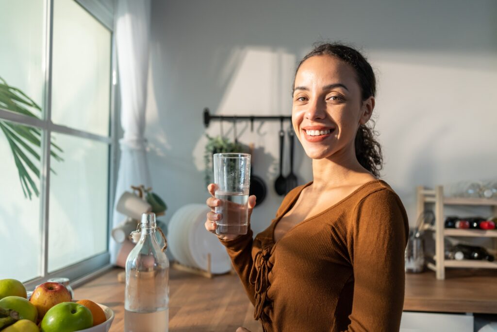 Woman Hydrating For Her First Massage At Xenana Spa In Portland, Oregon